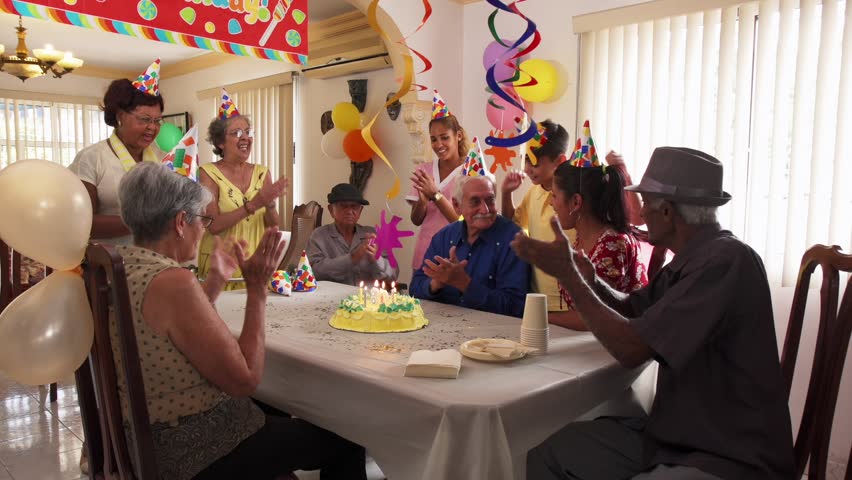 Group Of Old Friends And Family Celebrating Senior  Man 