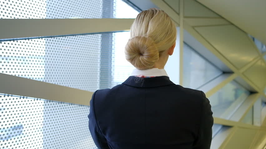 Blonde Stewardess Standing In Waiting Stockvideos Filmmaterial