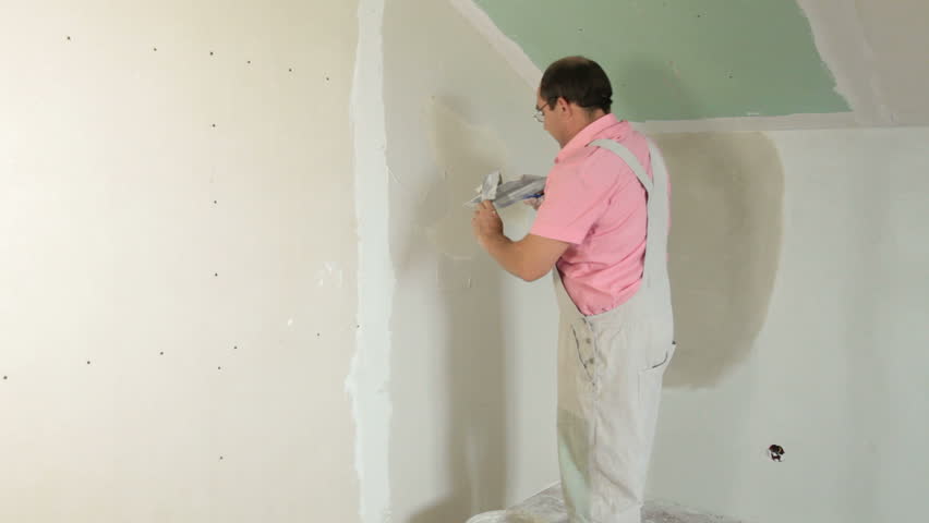 Man Applying Plaster On A New Drywall Installation Stock Footage Video ...