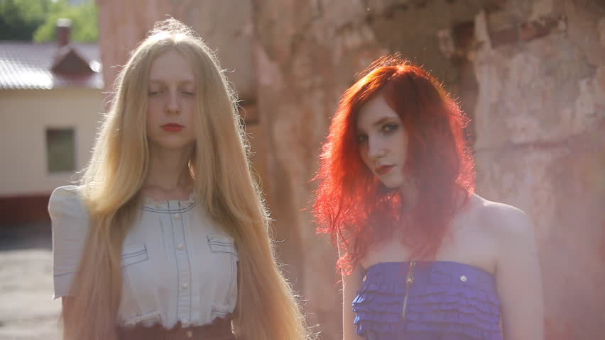 Two Women A Girl With Curly Red Hair And A Woman With Long Straight