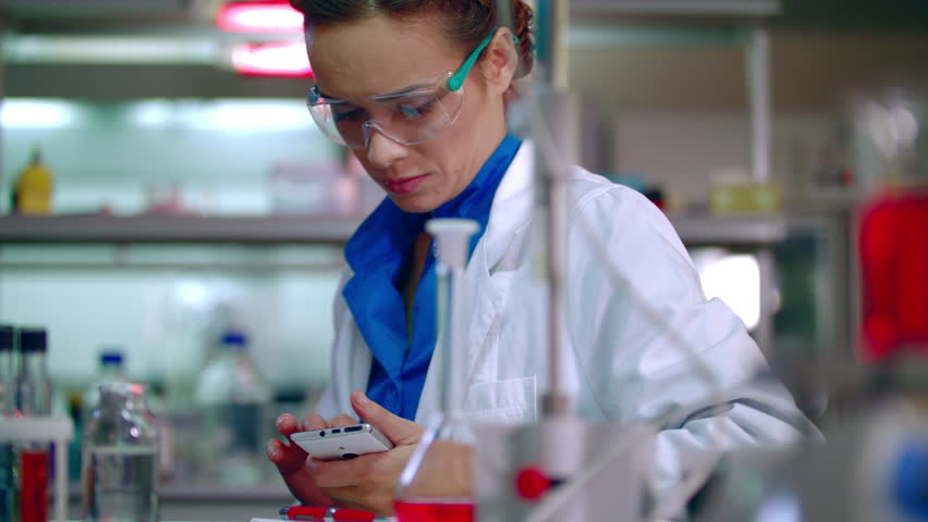 Lab Researcher Writing Research Report. Female Researcher In Lab ...