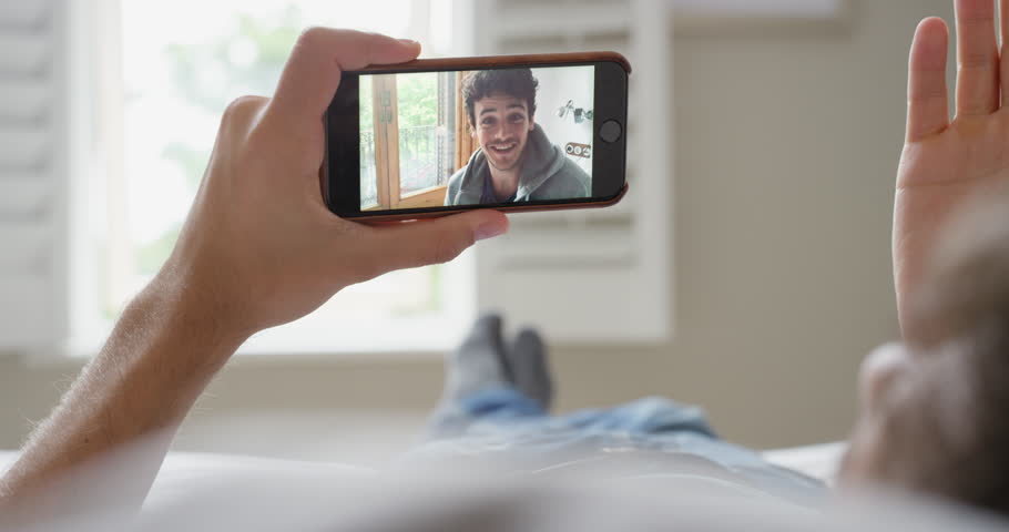 Beautiful Blonde Woman At Home Using Digital Tablet Technology To Connect Drinking Coffee In Bed