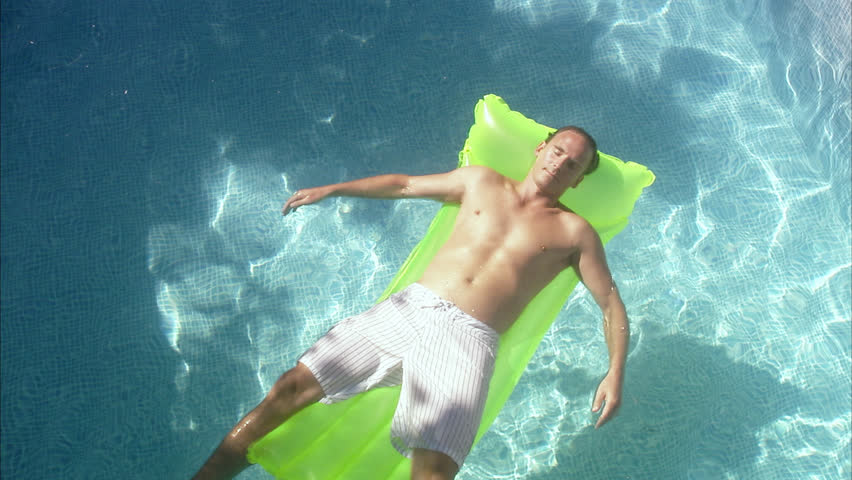 scene with air mattress floating on lake