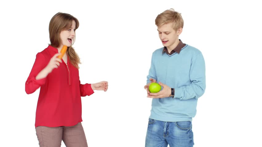 Cute Teens Fooling Around And Juggle With Fruits On White Background