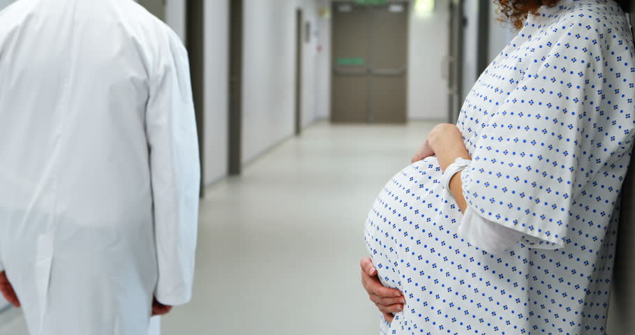 Pregnant Woman Standing In Hospital Gown At The Hospital Stock Footage ...
