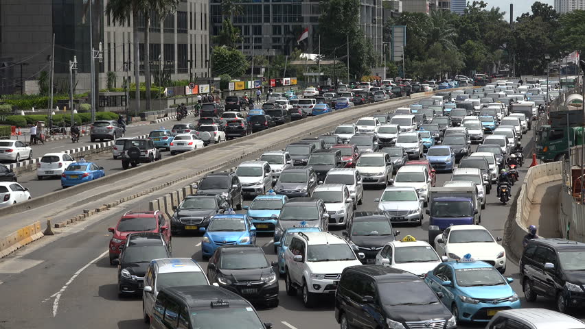 JAKARTA, INDONESIA - APRIL 2017: Modern Cars Are Stuck In A Traffic Jam