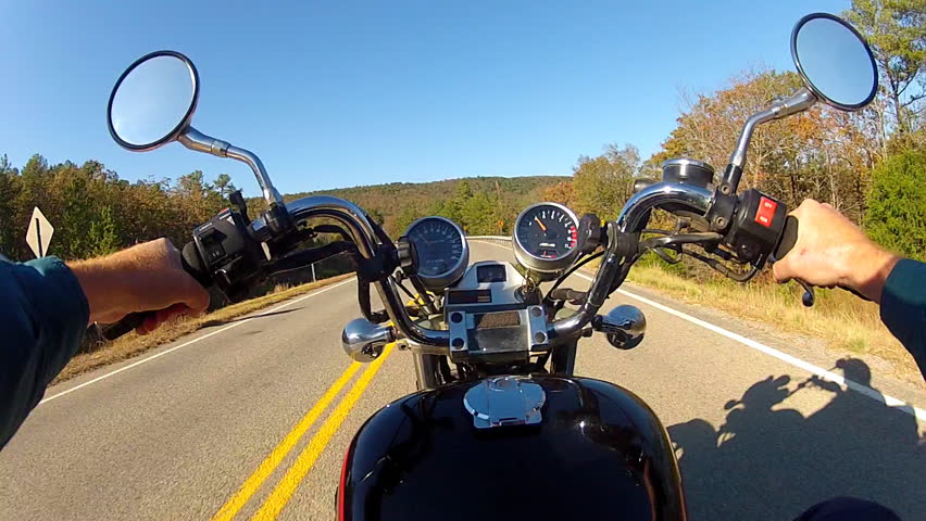 the point of view of a motorcycle rider on a rural road in south