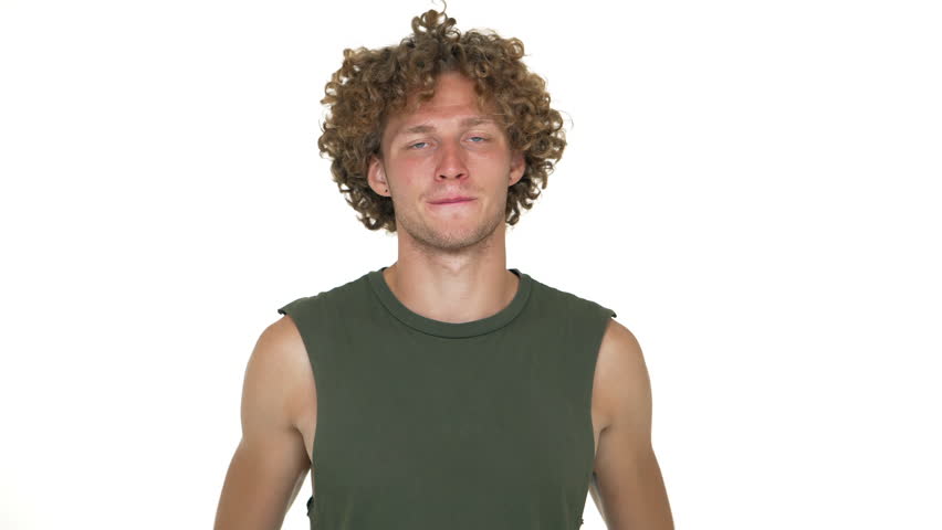 Caucasian Curly Guy In Green Stock Footage Video 100 Royalty