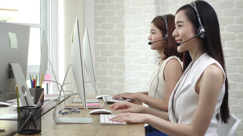 Smiling Beautiful Young Asian Businesswoman Telemarketing Customer Service Agent Team Working And Talking With A Friendly Happy Beautiful Asian Telemarketing Customer Service Agent Team