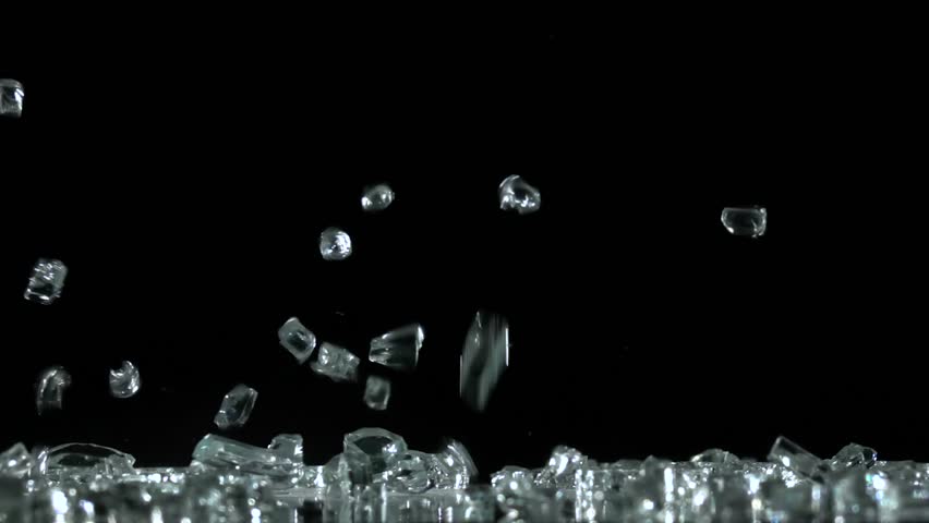 Diamonds And Crystals Fall And Hit The Floor In A Dark Spacious Room