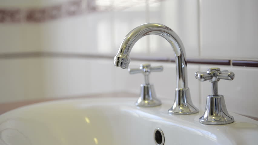 Woman Turning Off Hot Water Bathtub Faucet In The Bathroom Stock Water Running From A Chrome Tap Faucet Hd Stock Footage Clip