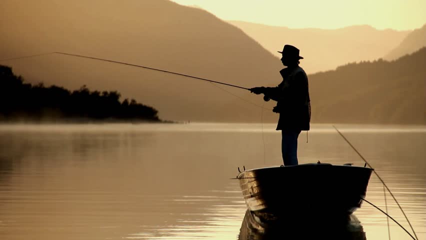 fly fisherman fishing from boat, stock footage video 100%