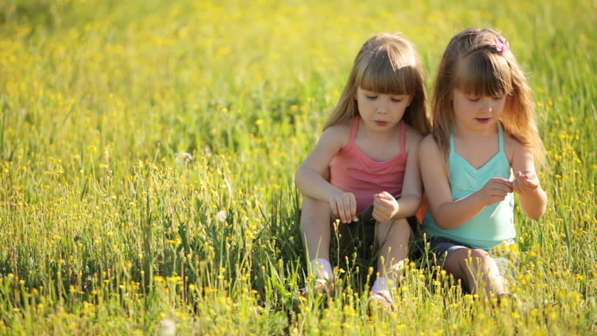 Cute Kids Sitting On Grass And Laughing Stock Footage Video 3909329 ...