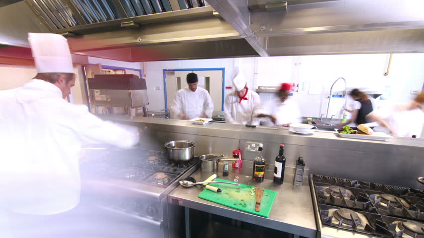 Restaurant Kitchen Video time lapse clip of a busy team of chefs, working hard and Restaurant Kitchen Video time lapse clip of a busy team of chefs, working hard and