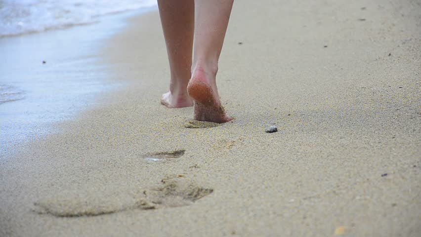 Girl Feet Walking On The Beach In Between Palm Trees In Slow-motion In ...