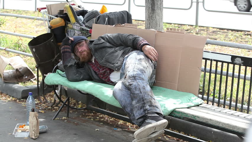Stock video of homeless man having a rest lying | 4349396 | Shutterstock