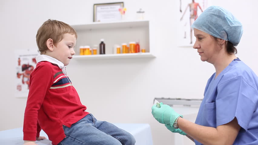 Nurse giving. Nurse boy.