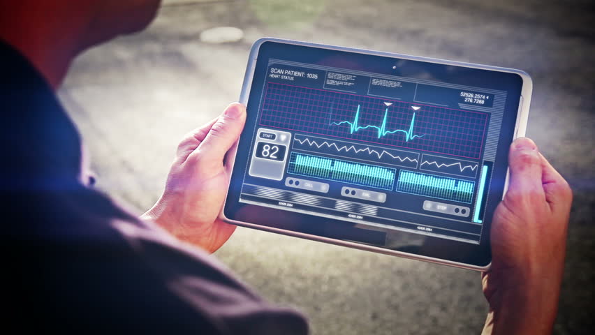 A doctor looks at a futuristic mobile health device.