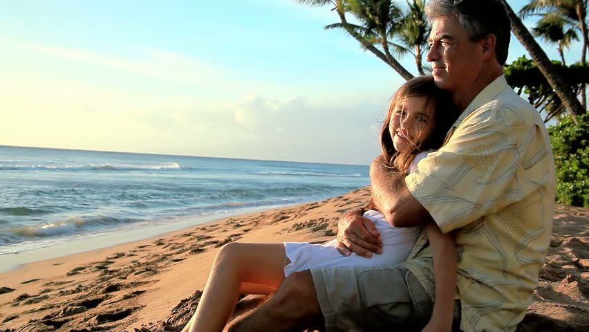 Daughter Sits In Fathers Lap On The Beach Stock Footage Video 4663397
