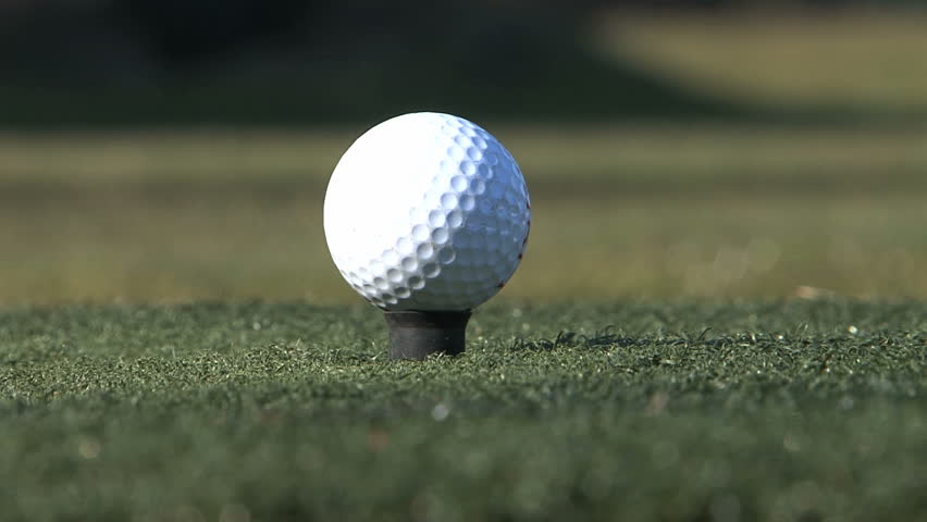 Golf Club Hits A Golf Ball In A Super Slow Motion, In Sunny Morning ...