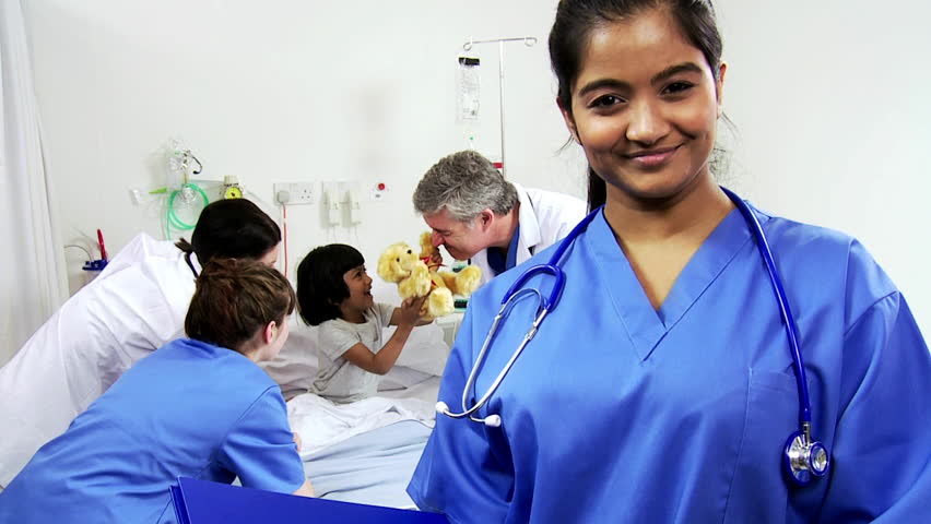 Portrait Asian Indian Pediatric Nurse Smiling To Camera -4276
