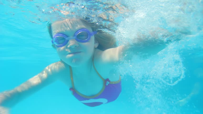 Underwater View Young Girl Wearing Goggles Waving At Camera. Stock ...