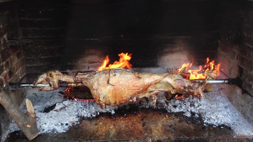 Spit Roasting Lamb In Fire Pit