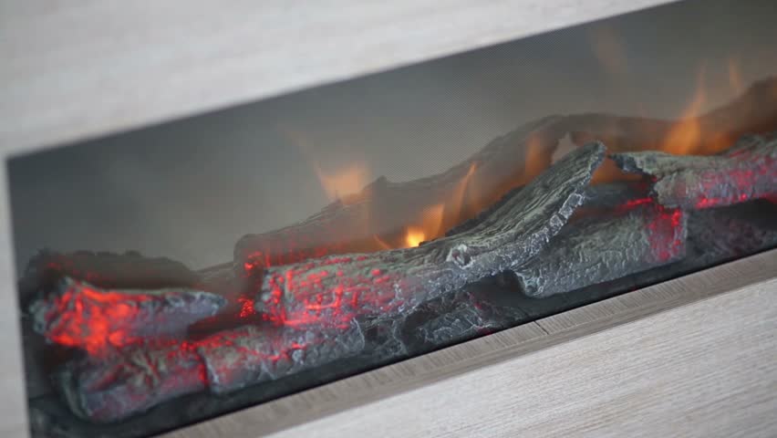 Artificial Fireplace With Burning And Smoldering Small Logs