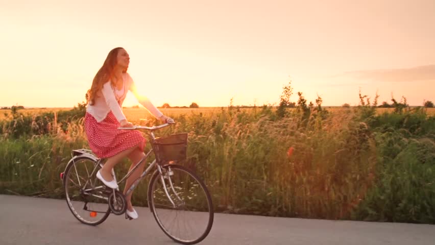 Joyful Young Woman Riding Bicycle Slow Motion Sunset Stock Footage ...