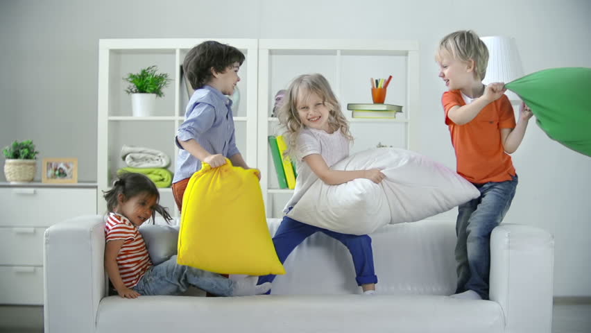 Hd00 24four Kids Playing On Sofa Pillow Fighting