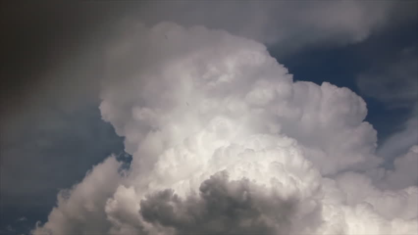 Look at those dark clouds it rain. Look at those enormous black clouds it rain soon.