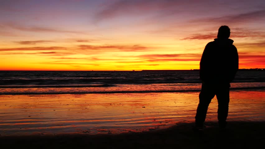 Young Man Praising And Worshiping God During Sunset By The Sea Stock ...